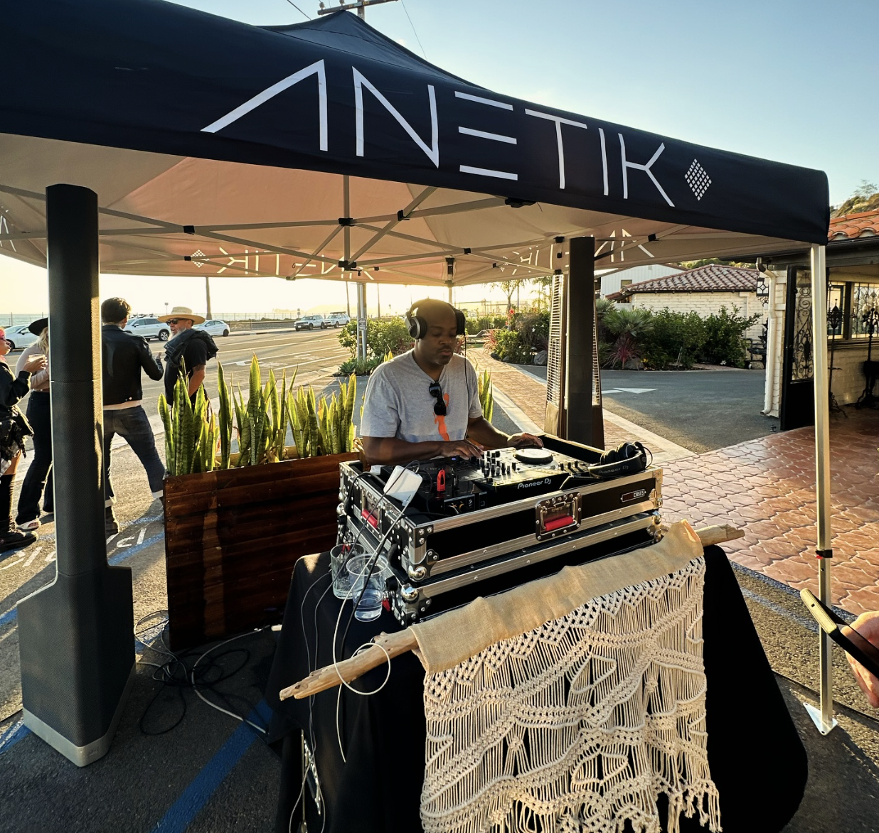 Outdoor DJ and sound system at a coastal event